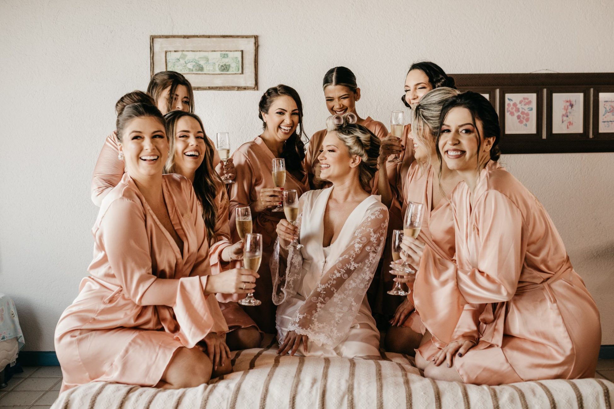 Bridal party in champagne color toasting before the wedding