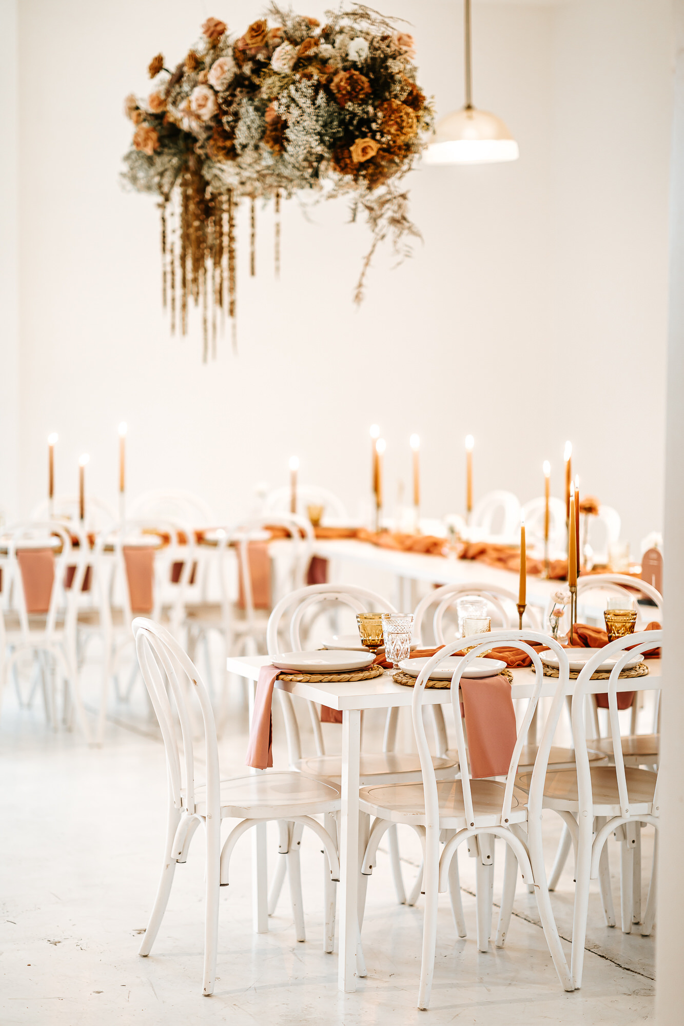 White bohemian wedding reception table details at the emerson venue.