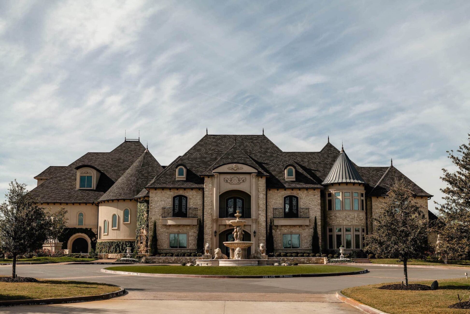 Entrance of Knotting Hill Place: A grand, beautifully adorned entrance leading to the enchanting wedding venue in Little Elm, Texas